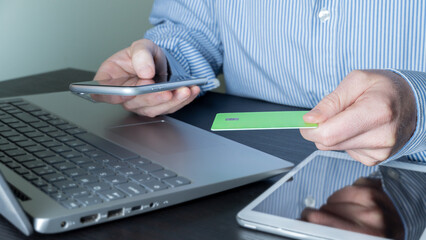 shopaholic consumer, makes online transaction with credit card and mobile, easy and fast purchase