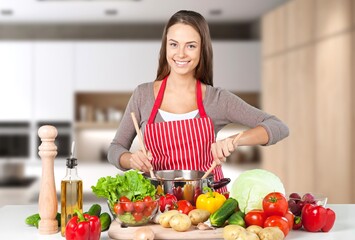 Young female cooking in modern kitchen