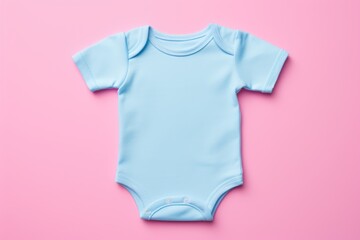 A blue baby bodysuit mockup on a pink backdrop, ideal for showcasing design and fashion for infants