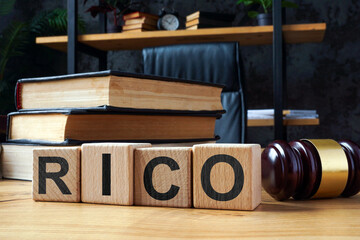 Cubes with letters RICO Racketeer Influenced and Corrupt Organizations Act and gavel.