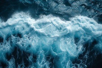 An abstract textured background of blue ocean waves, blending clear liquid motion with foamy splashes.