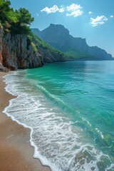 Obraz premium An exquisite beach offers stunning turquoise waters, rugged cliffs, and tranquil scenery for vacationers.