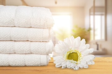 Fototapeta na wymiar Stack of clean fresh aroma laundry in bathroom
