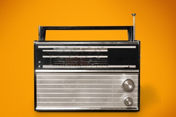 old radio on yellow background, music concept