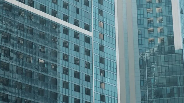 Facade of moderm multi storey glass building. Architecture abstract background. Building skyscraper house, industrial development