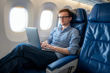 Man Working on Laptop in Airplane Cabin. Generative AI.