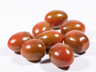 pear kumato cherry tomato on white background