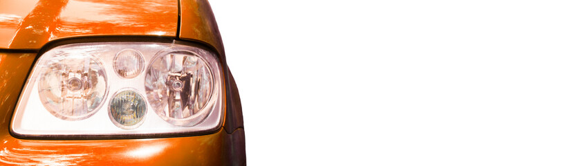 front headlight on a orange car. concept of selling auto parts	