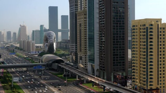 Establishing shot of Dubai, UAE, showing traffic on Sheikh Zayed Road during daytime. 