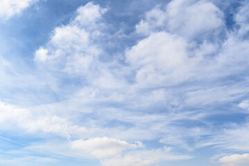 White clouds in a bright blue sky. The beauty of the nature	