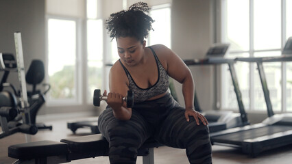 plus size woman exercising in gym
