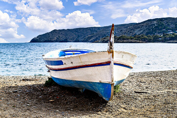 Typical fishing boat on the beach of the picturesque coastal town of Cadaques, Costa Brava, Girona