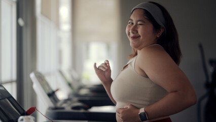 plus size woman exercising in gym