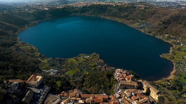 Aerial view of Lake Nemi. It is a small circular volcanic lake in the Alban Hills, near Rome in the Lazio region of Italy. It was formed in an ancient volcanic crater.