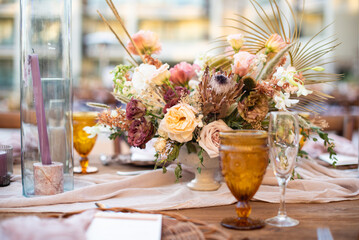 A centerpiece is a central decorative object, often flowers, candles or fruit, and is an important part of the wedding reception decoration.