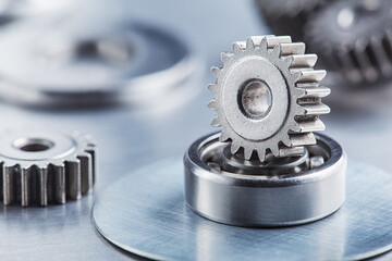 metal gears and bearings. Background with part of the mechanism.