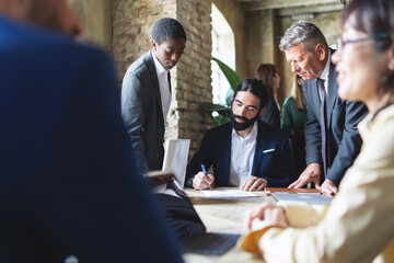 Diverse corporate team strategizing - Collaborative meeting - Innovation, teamwork, planning, creative workspace.