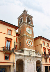 Fototapeta na wymiar Clock Tower (or Torre dell' Orologio) at Piazza Tre Martiri in Rimini, Italy 