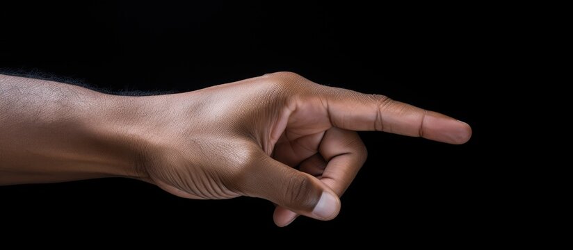 Engaging Hand Gesture: Close-up Pointing Towards Viewer with Clarity and Purpose
