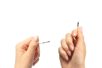 Lit match in a woman hand isolated on a white background.