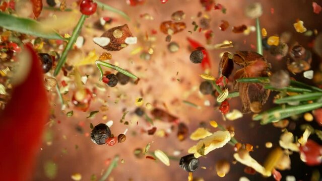 Super Slow Motion of Falling and Rotating Spices Mix. Filmed on High Speed Cinema Camera, 1000 fps. 