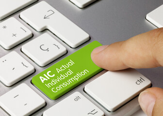 AIC Actual Individual Consumption - Inscription on Green Keyboard Key.