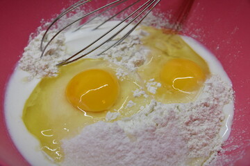 Eggs in flour preparing dough