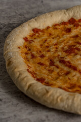 homemade pizza ready to eat gray background