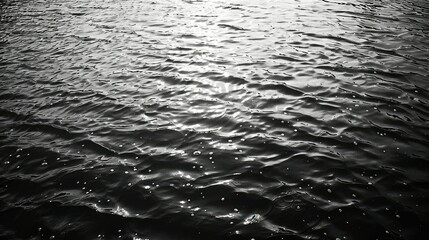 Rippling dark water surface, monochromatic and textured. - obrazy, fototapety, plakaty