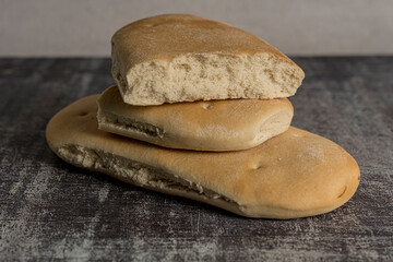 homemade bread ready to eat gray background