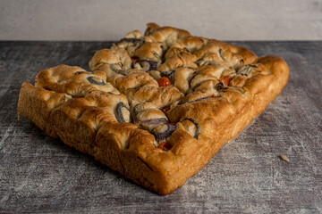 homemade focaccia tomato onion gray background ready to eat