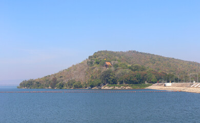 View of Ubonrat Dam during the day with sunlight and clear weather.