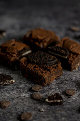 brownie with oreo cookie gray background ready to eat