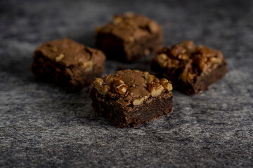 chocolate brownie with walnuts gray background ready to eat