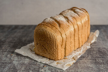 freshly made whole wheat bread gray background