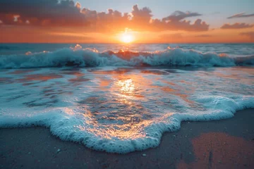 Foto op Canvas A serene ocean scene as the sun sets creating a vibrant sky and gentle foamy waves, conveying peace and natural beauty © svastix