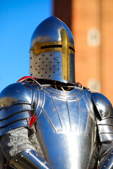medieval knight with steel armor and helmet to protect his head