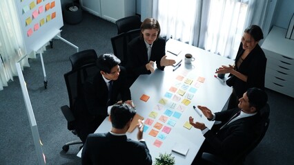 Top view of business people brainstorm idea by using sticky notes while planning marketing strategy...