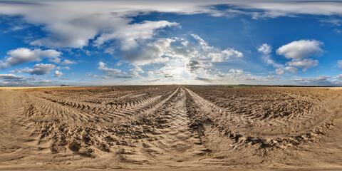 360 hdri panorama view on no traffic gravel road among fields in spring day with beautiful clouds...