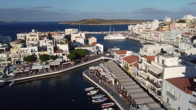 Aerial view of Agios Nikolaos, a picturesque coastal town with colorful buildings around the port in the eastern part of the island Crete, Greece
