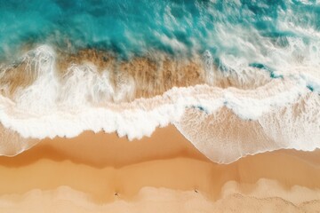 Aerial View of Turquoise Waves Crashing on a Golden Beach