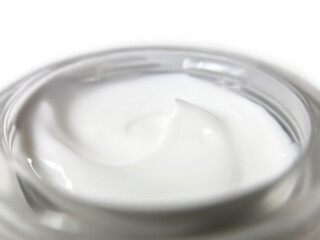 close-up glass jar with cosmetic cream