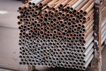 Big stack of iron bars used in road construction and tram rail reconstruction