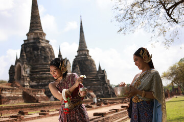 Asian women wearing typical (traditional)Thai dress, vintage original Thailand attire, identity...