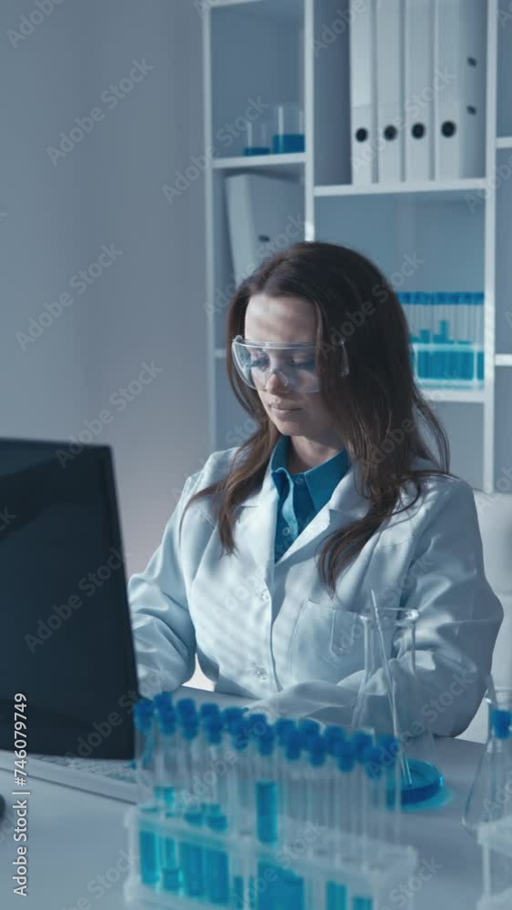 Poster in this vertical video medical scientist performs blood test for viral and bacterial infections in l