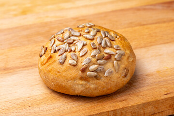 Bread with seeds on a wooden board.