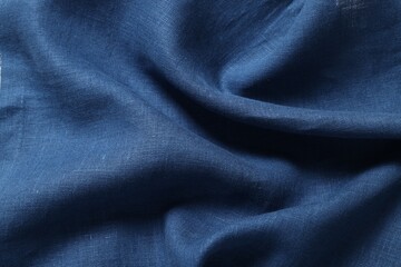 Texture of blue crumpled fabric as background, closeup