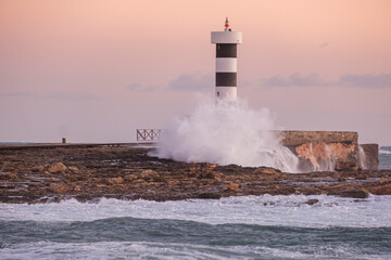 strong waves on the Puntassa lighthouse in Colònia de Sant Jordi, ses Salines, Mallorca, Balearic...