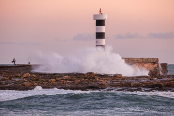 strong waves on the Puntassa lighthouse in Colònia de Sant Jordi, ses Salines, Mallorca, Balearic Islands, Spain