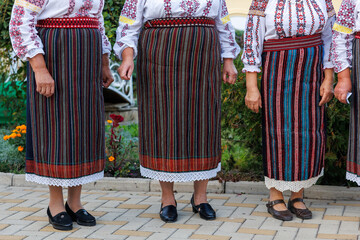 Authentic Moldovan national women's costumes. Background with selective focus and copy space